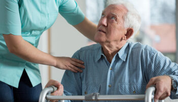 Portrait of disabled senior in care home